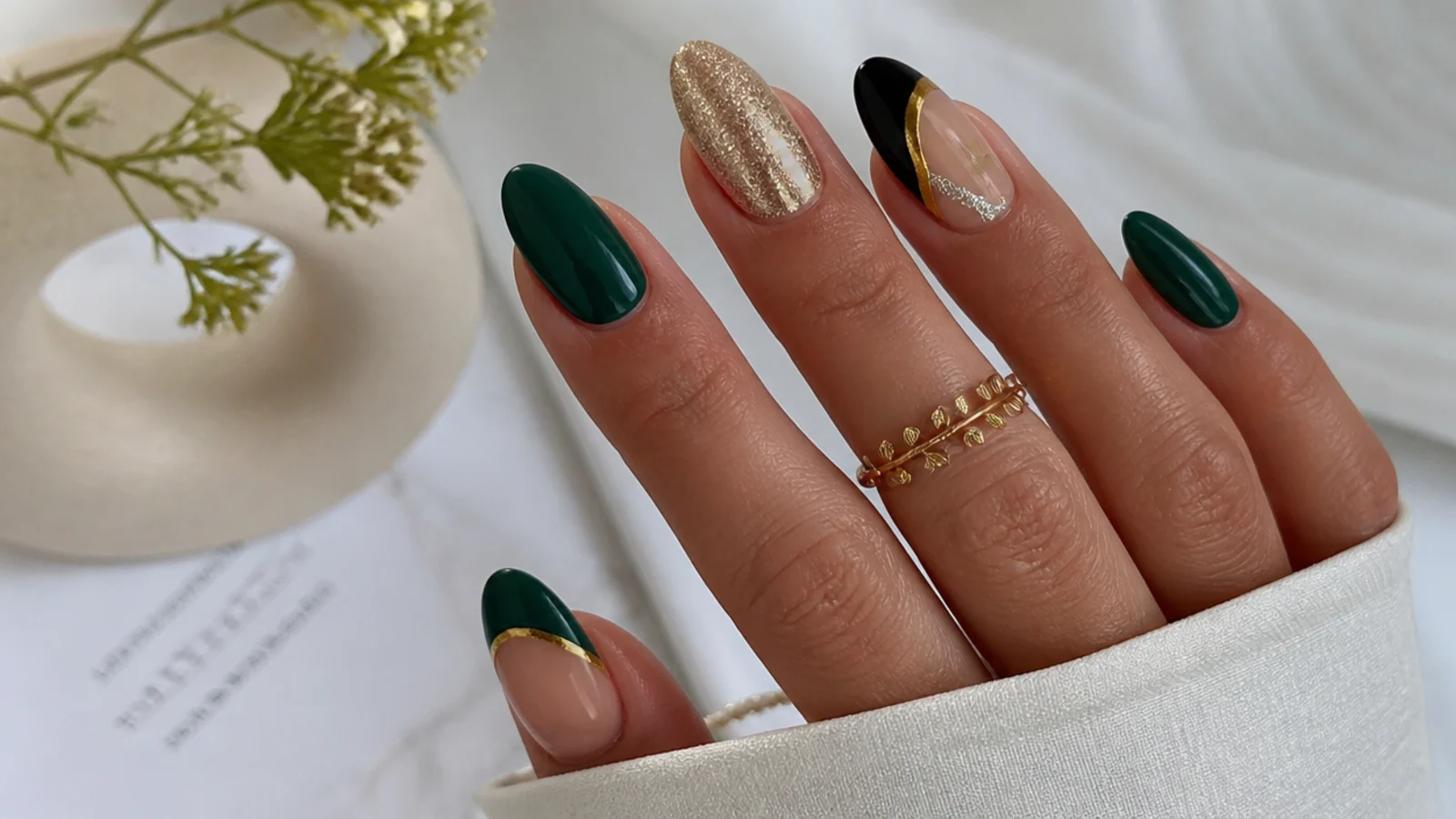 Dark green nails shown beside gold, silver, black and nude accents