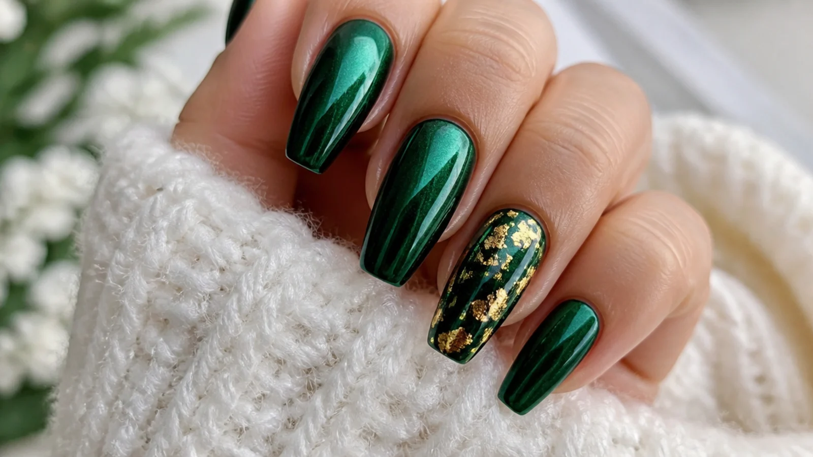 Emerald chrome nails with thin gold foil flakes on one accent