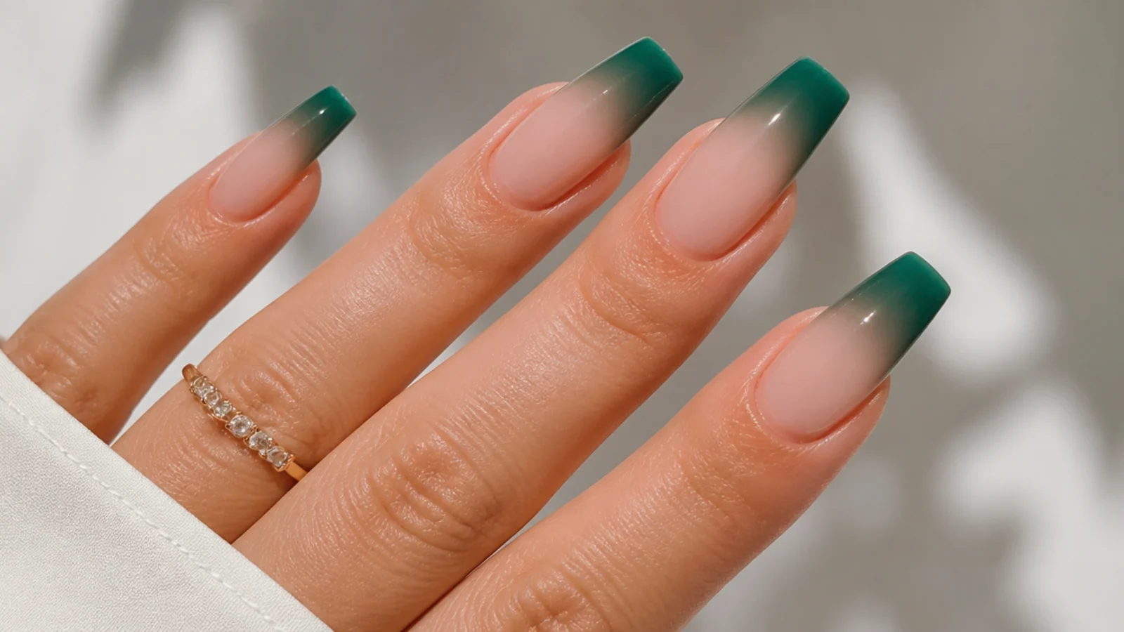 Emerald green ombre french tip fading into nude on coffin nails