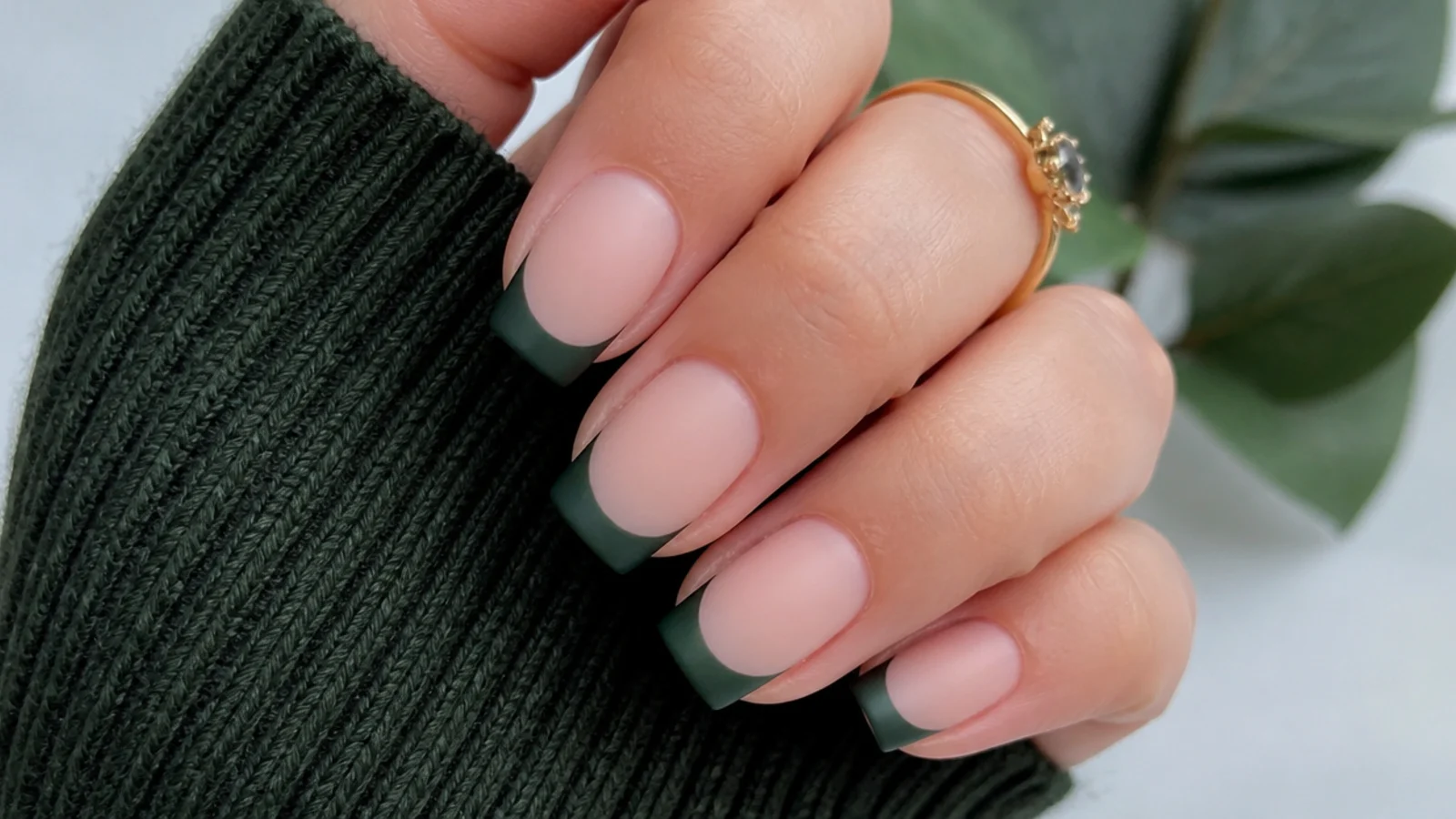 Matte forest green french tip nails with a velvety flat finish on squoval nails