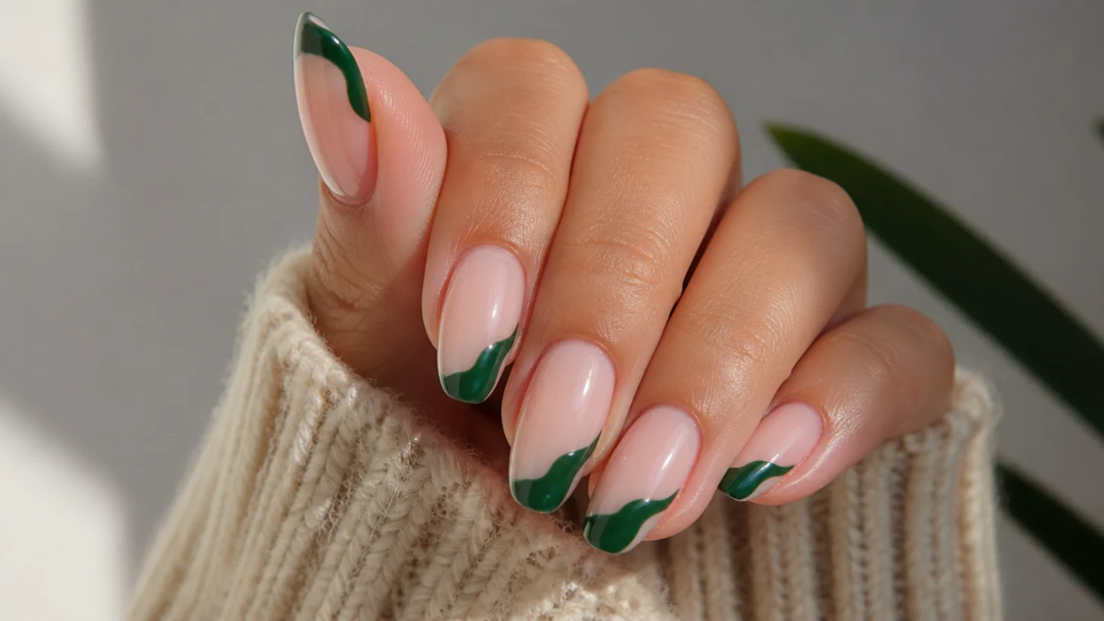 Emerald green wavy swirl french tip instead of a straight smile line on nude nails