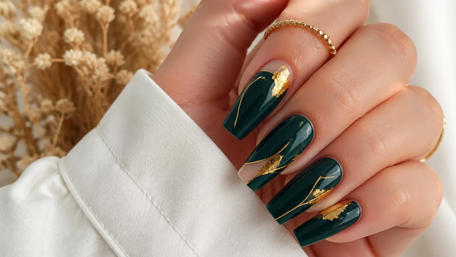 Coffin nails in dark emerald green with gold foil and thin gold line accents