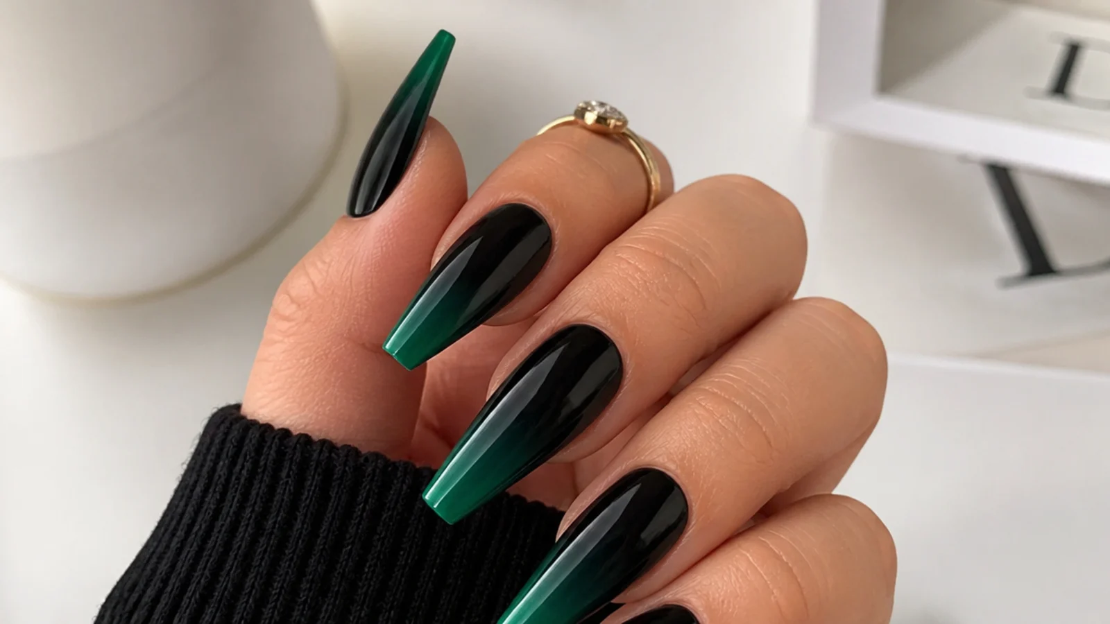 Coffin nails fading from black at the cuticle into dark emerald green at the tips