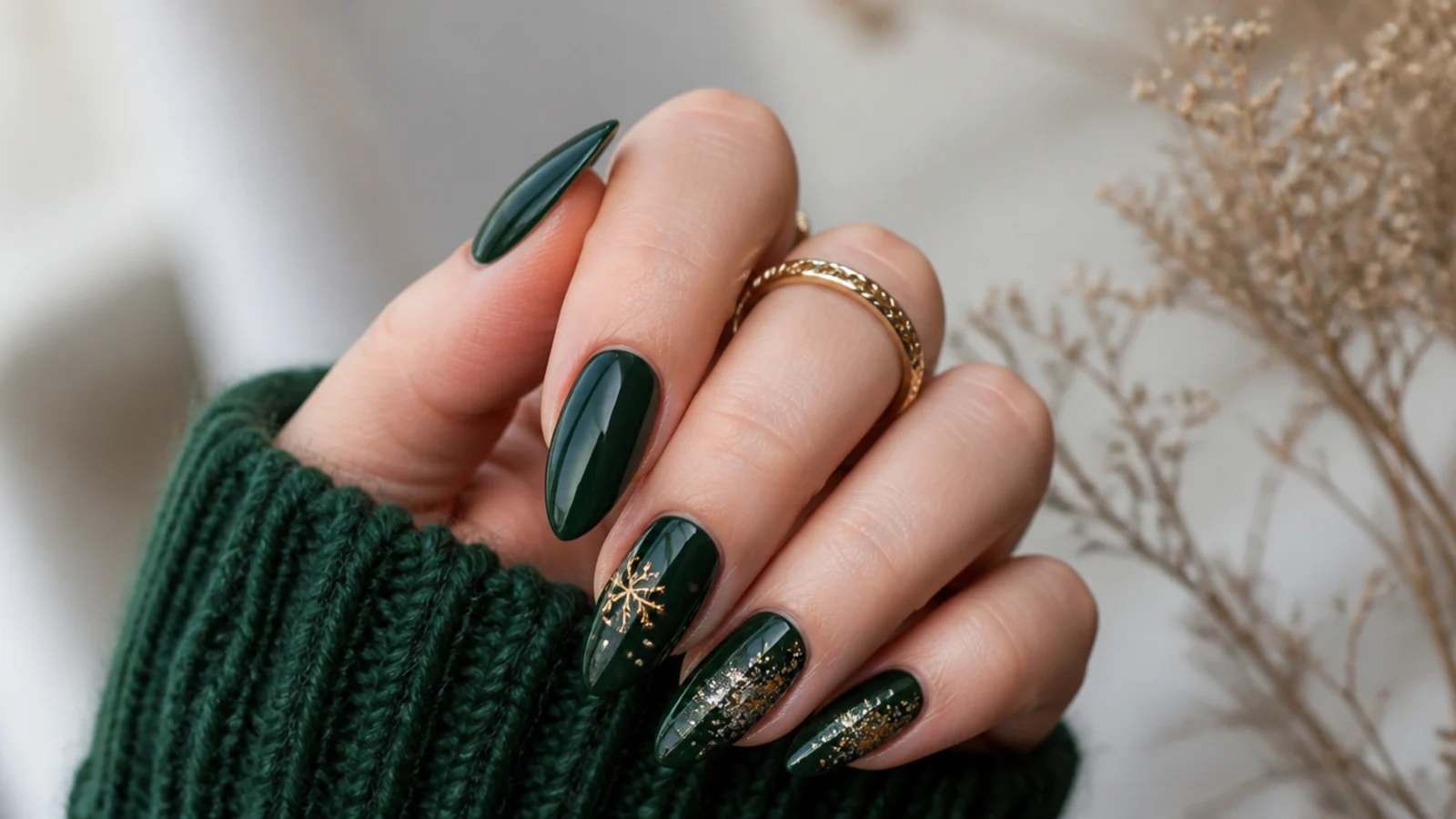 Dark green nails styled for fall, winter and holiday occasions