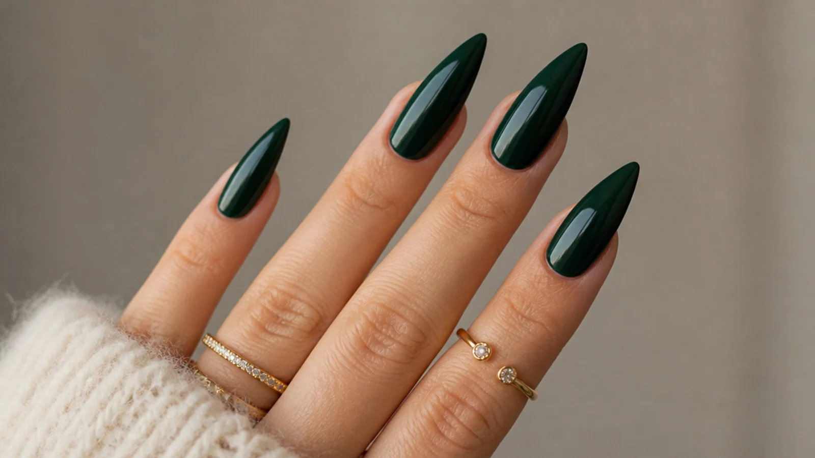 Deep bottle green glossy stiletto nails with a sharp point