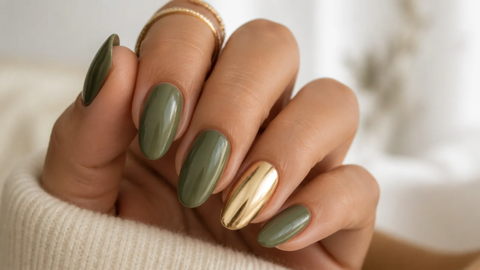 Warm olive green nails with a gold chrome accent nail