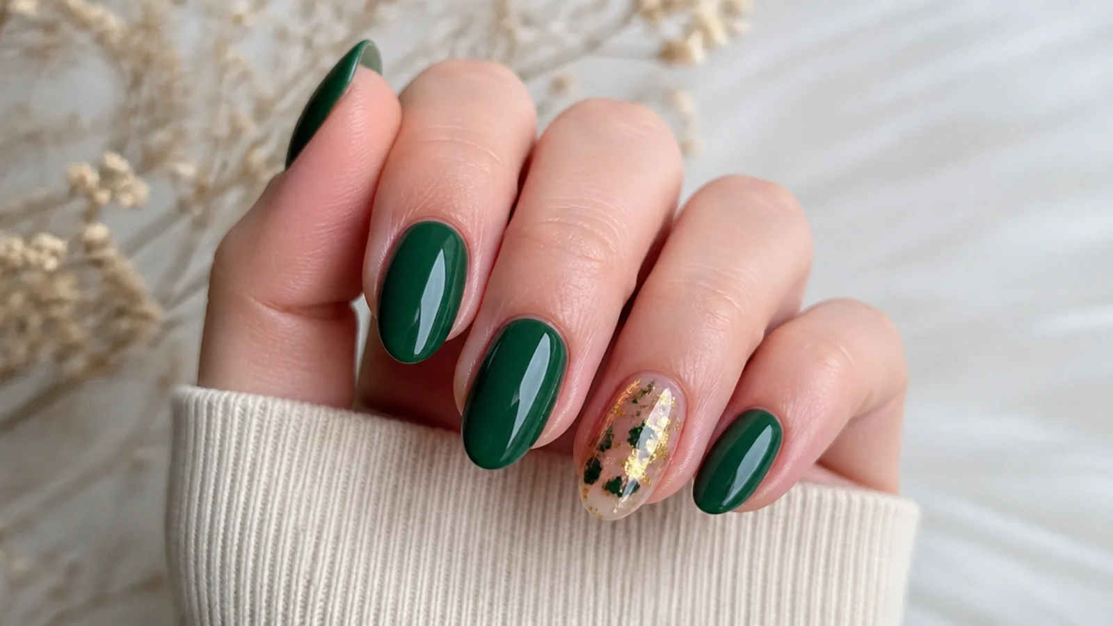 Emerald green nails with one gold foil flake accent nail