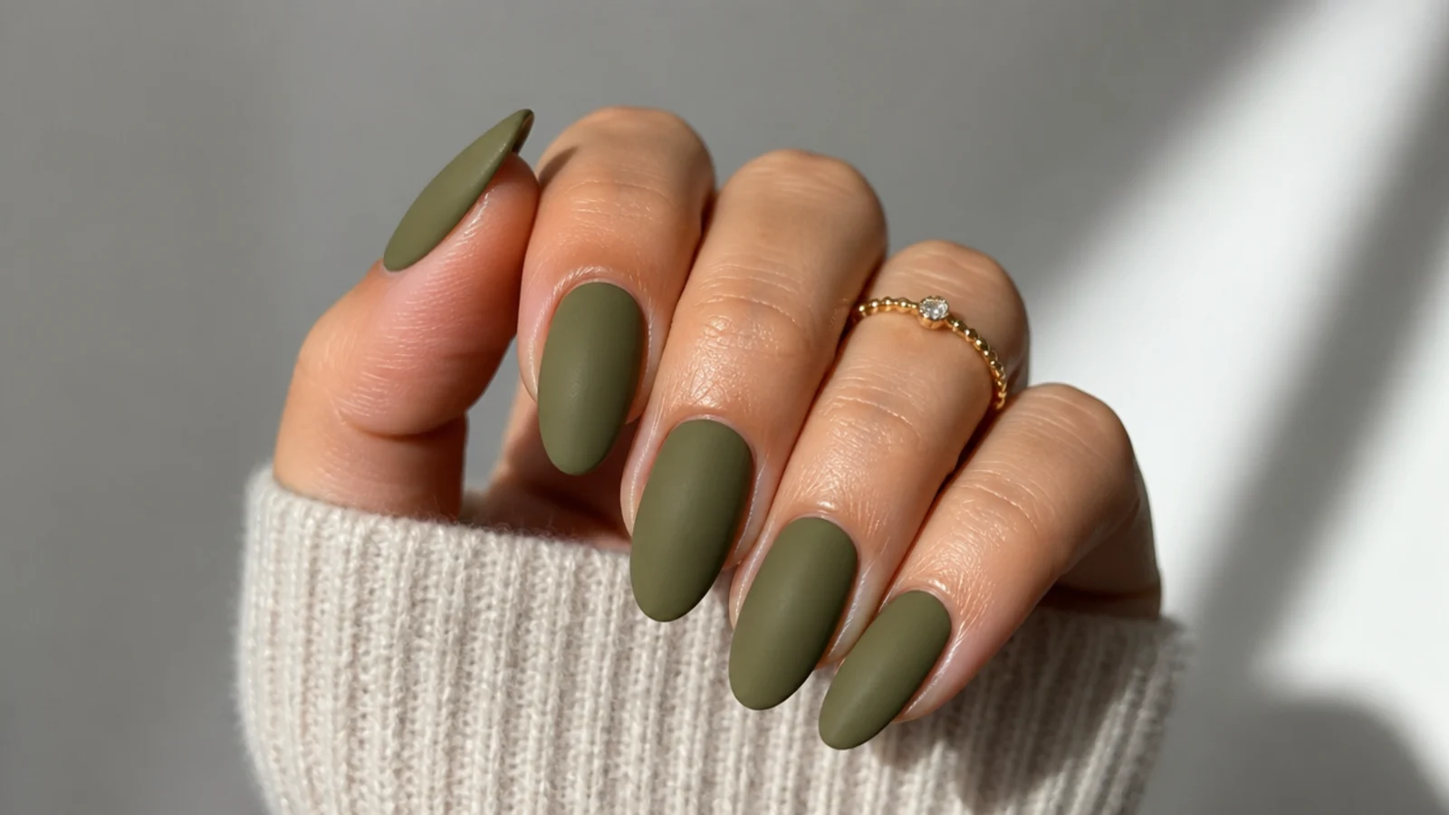 Warm olive green nails with a soft matte velvet finish
