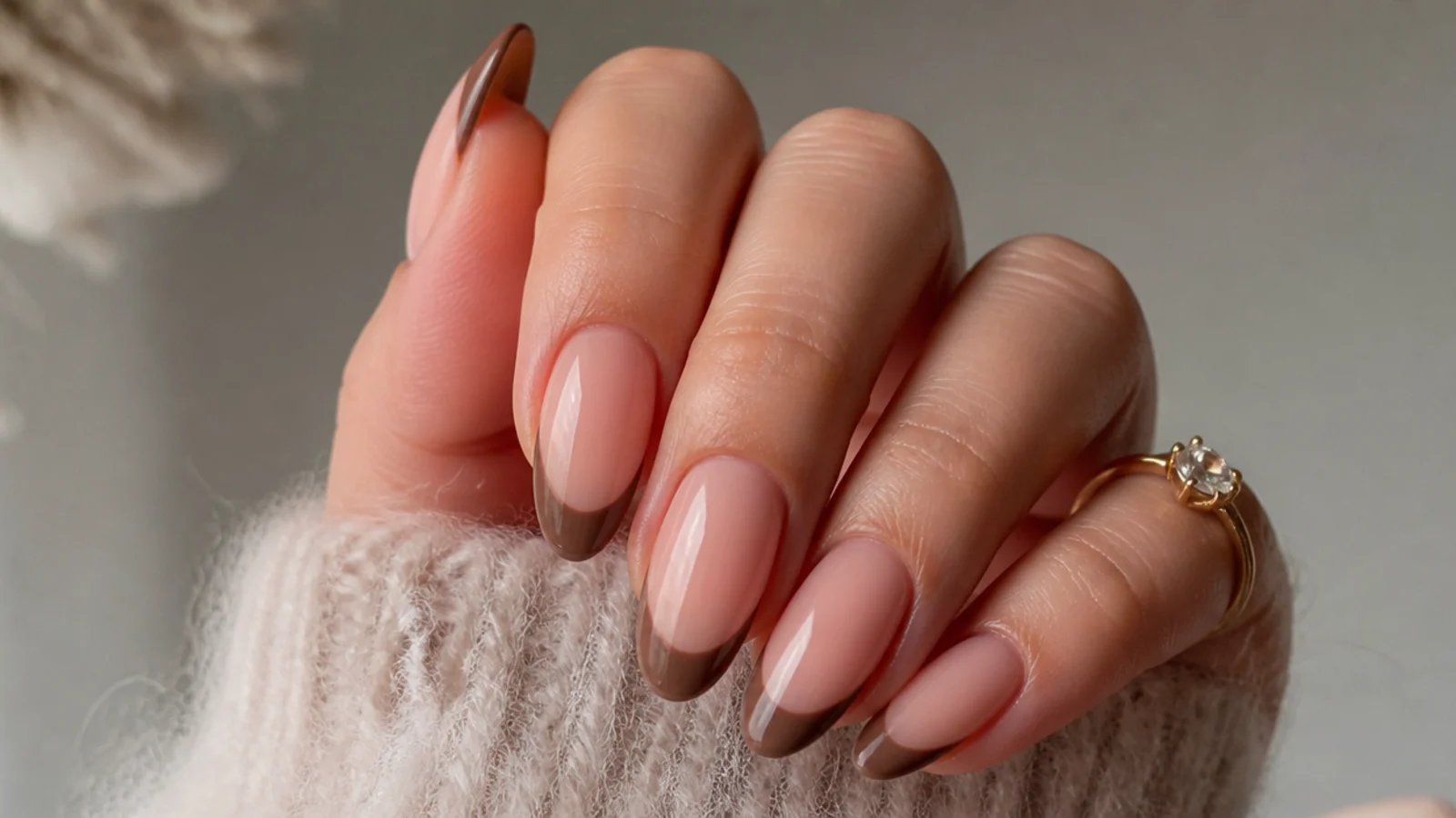 Nude almond December nails with warm brown mocha French tips
