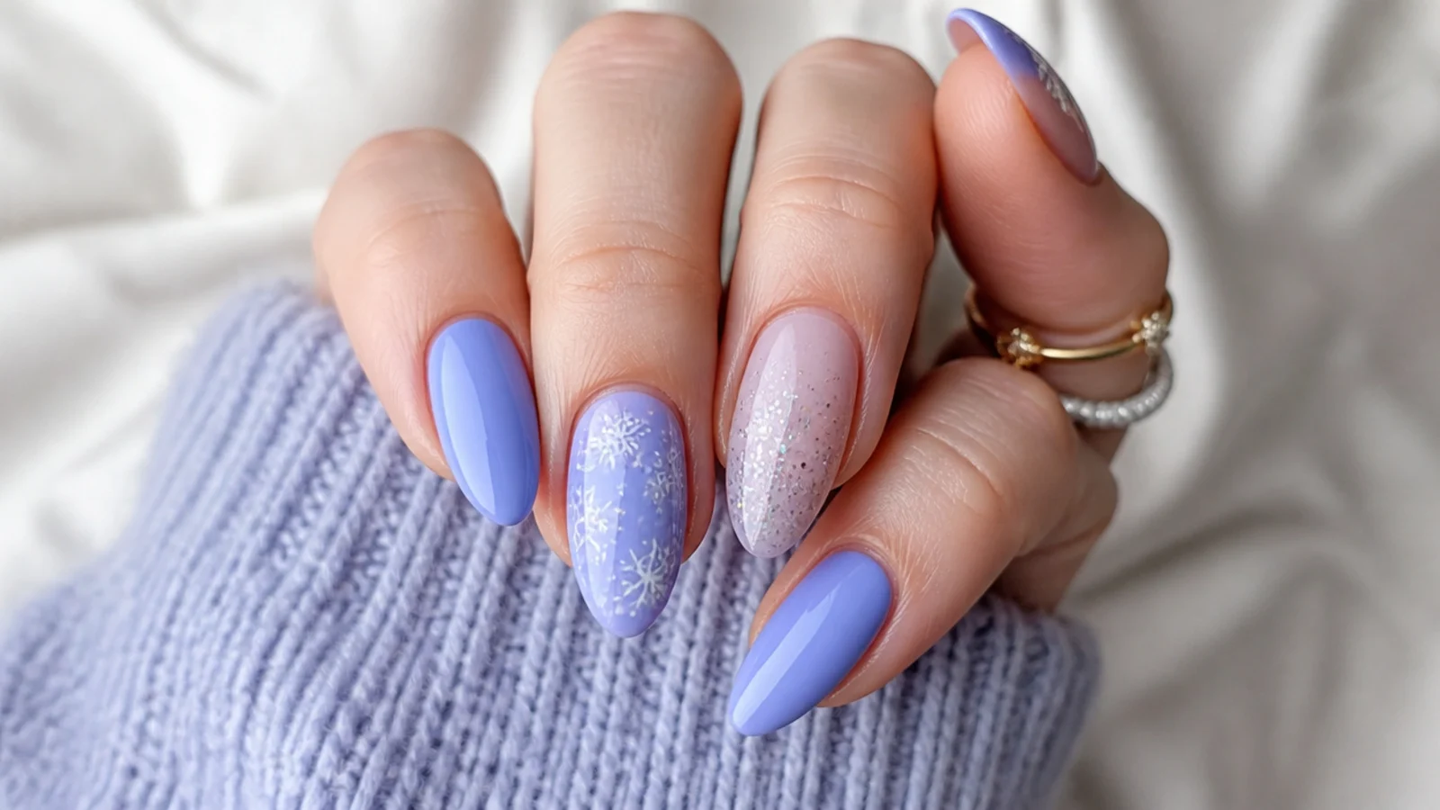 Soft periwinkle blue-purple December nails on almond shape
