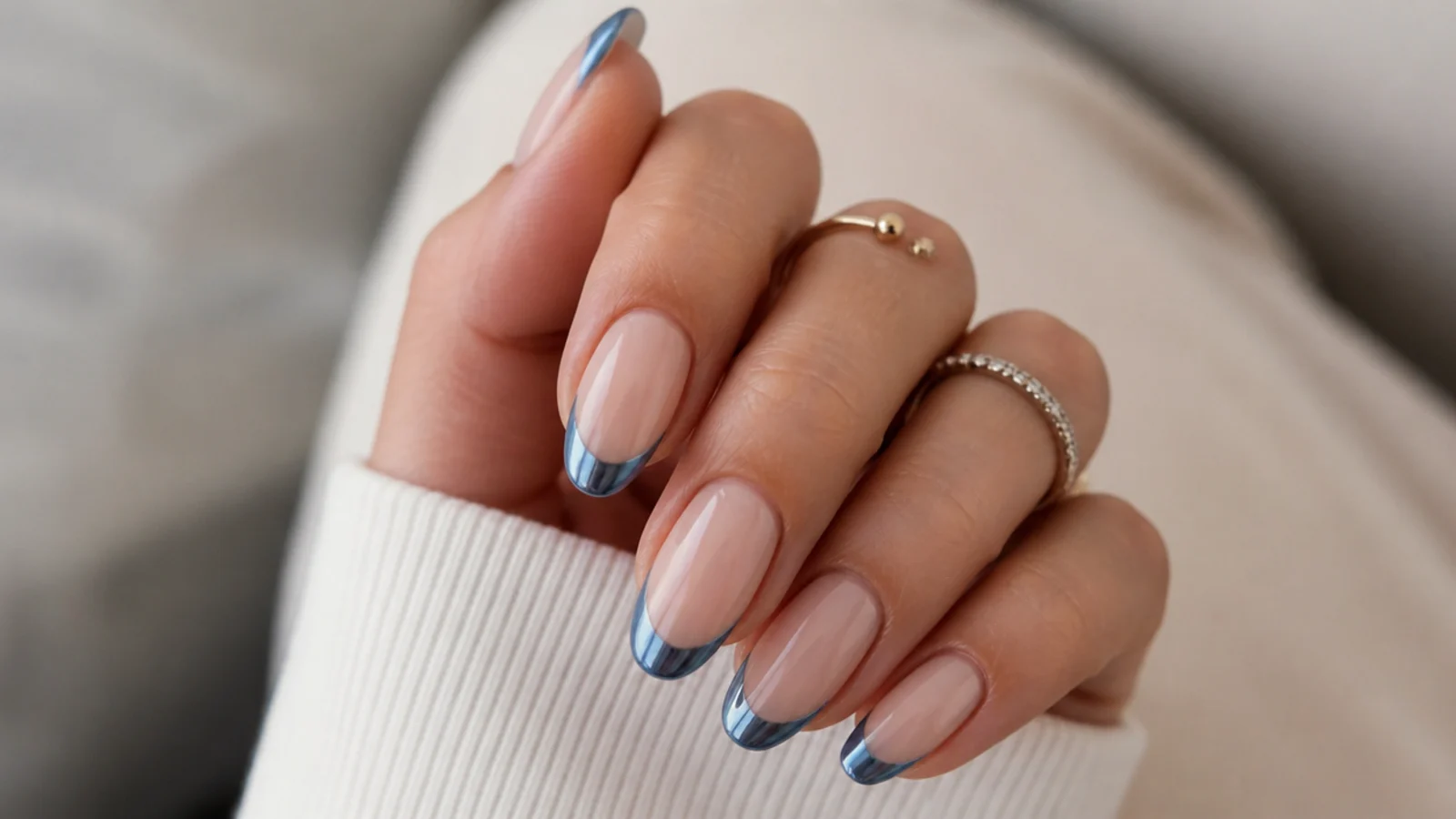 Nude December nails with steel blue chrome French tips