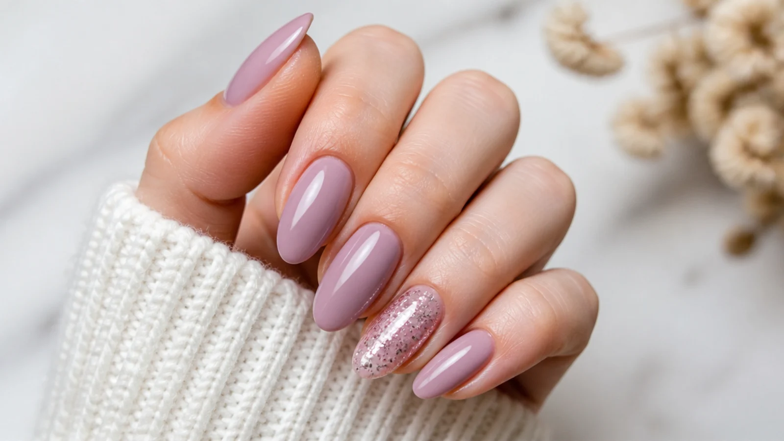 Soft milky mauve December birthday nails with one glitter accent