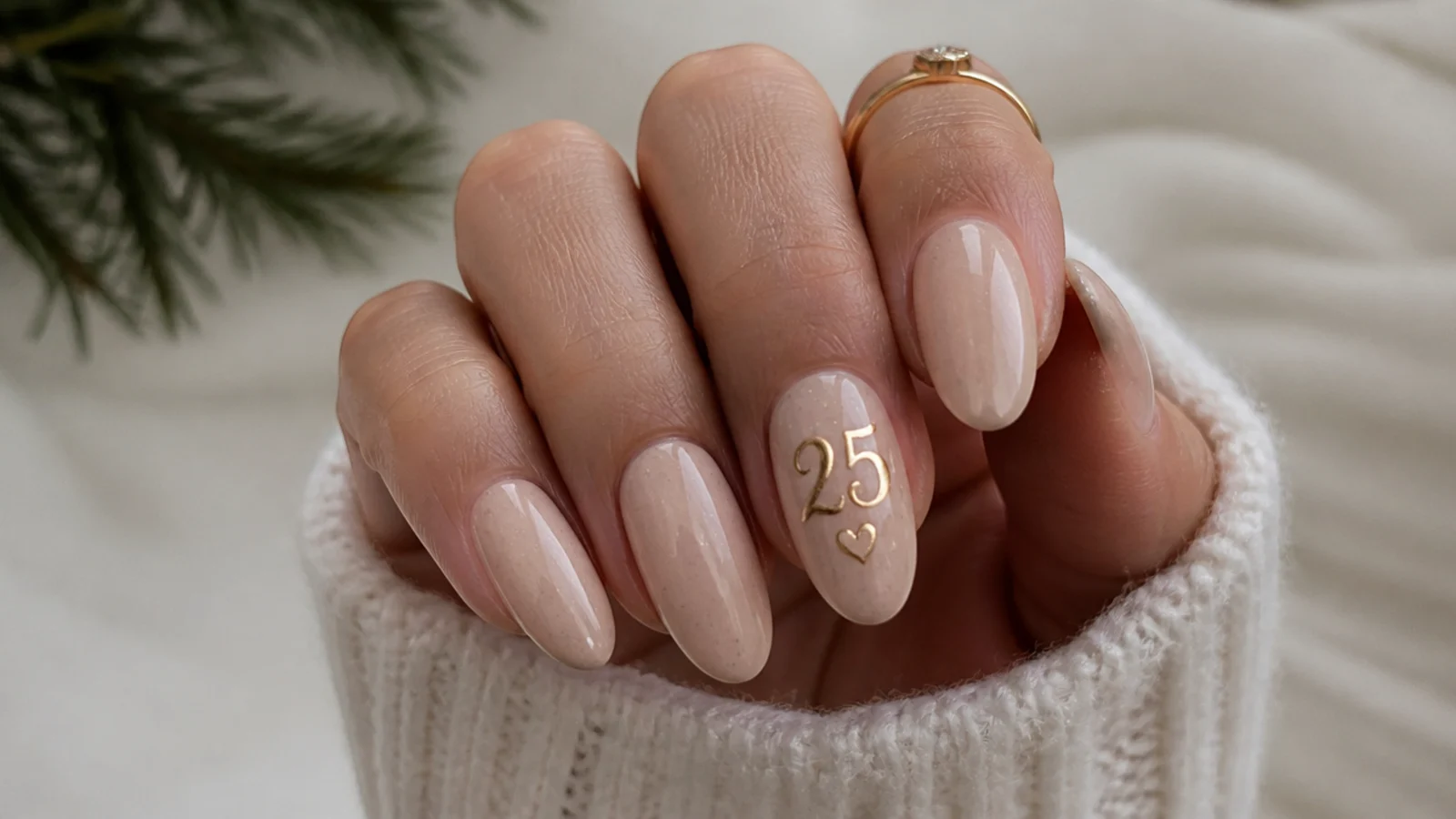 Neutral December birthday nails with a gold hand-drawn birthday number