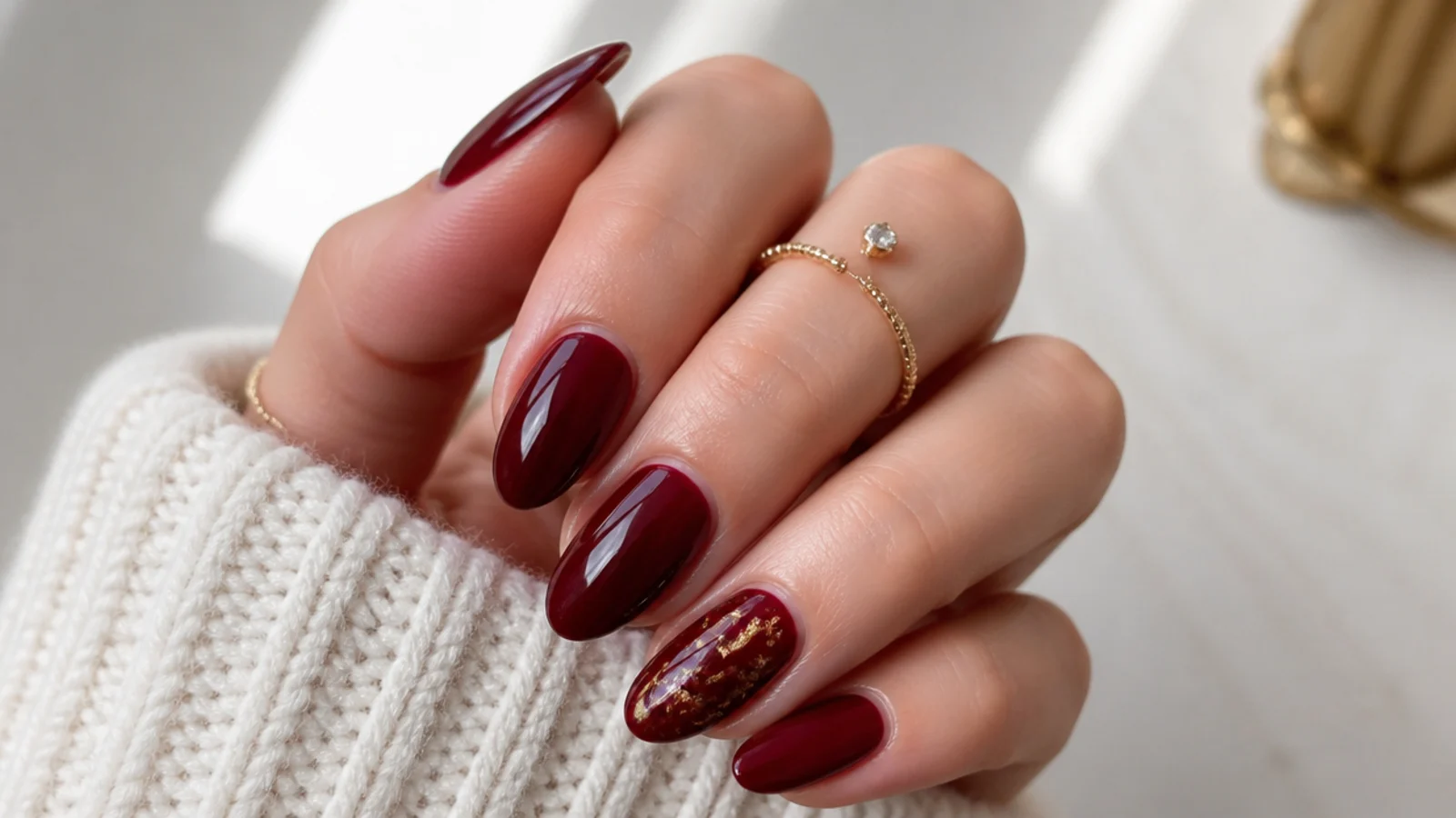Deep vampy oxblood burgundy December nails on almond shape