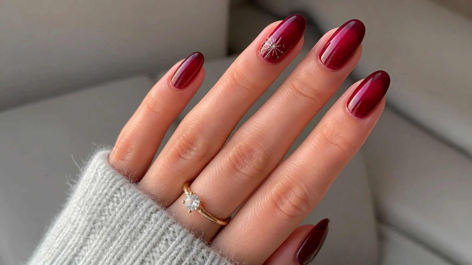 Translucent cranberry jelly December nails with a glassy finish
