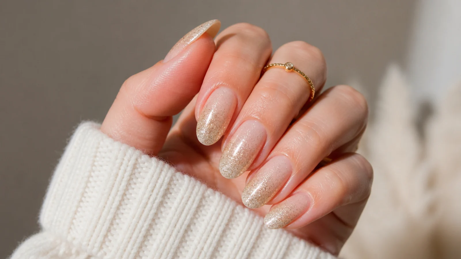 Champagne gold glitter ombre fading from the tips of December nails