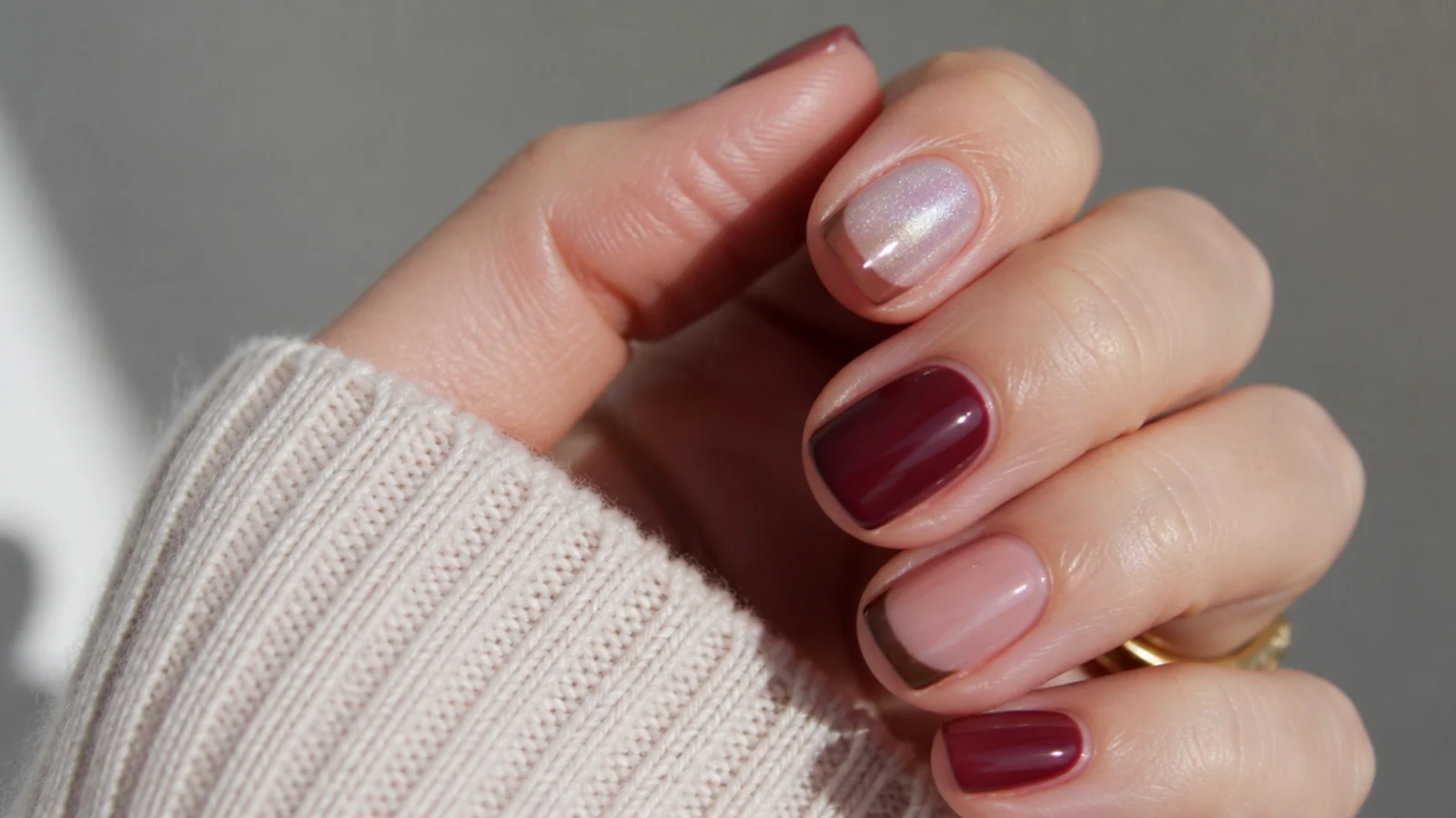 Short squoval and round nails in cranberry, chocolate French and icy chrome