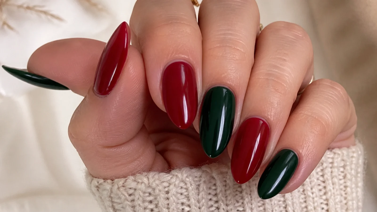 Alternating red and forest green glossy December nails, color blocked