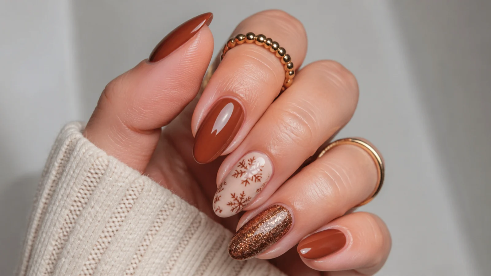 Warm reddish cinnamon brown December nails with glossy finish