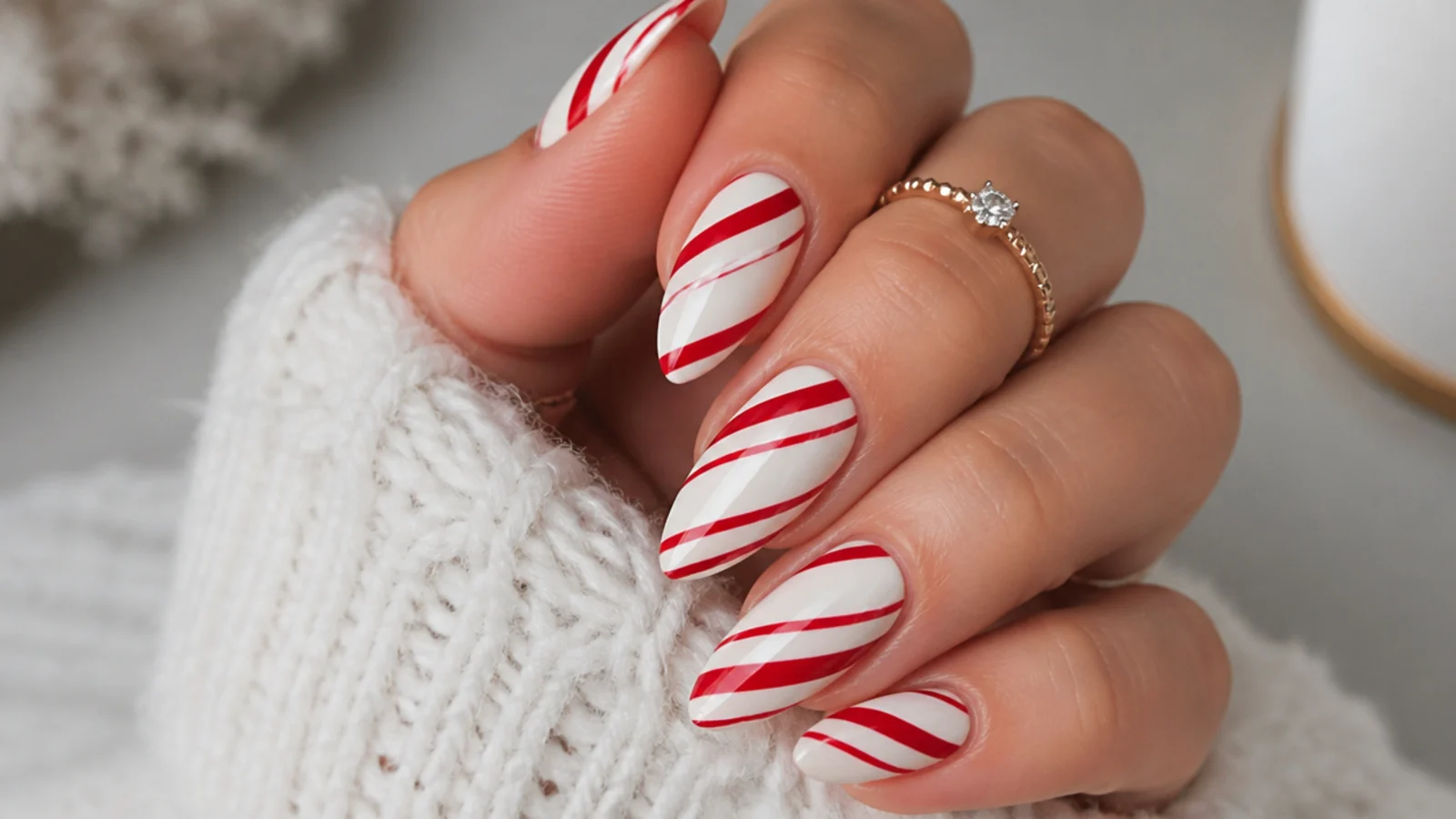 Red and white candy cane stripe December nails on a white base