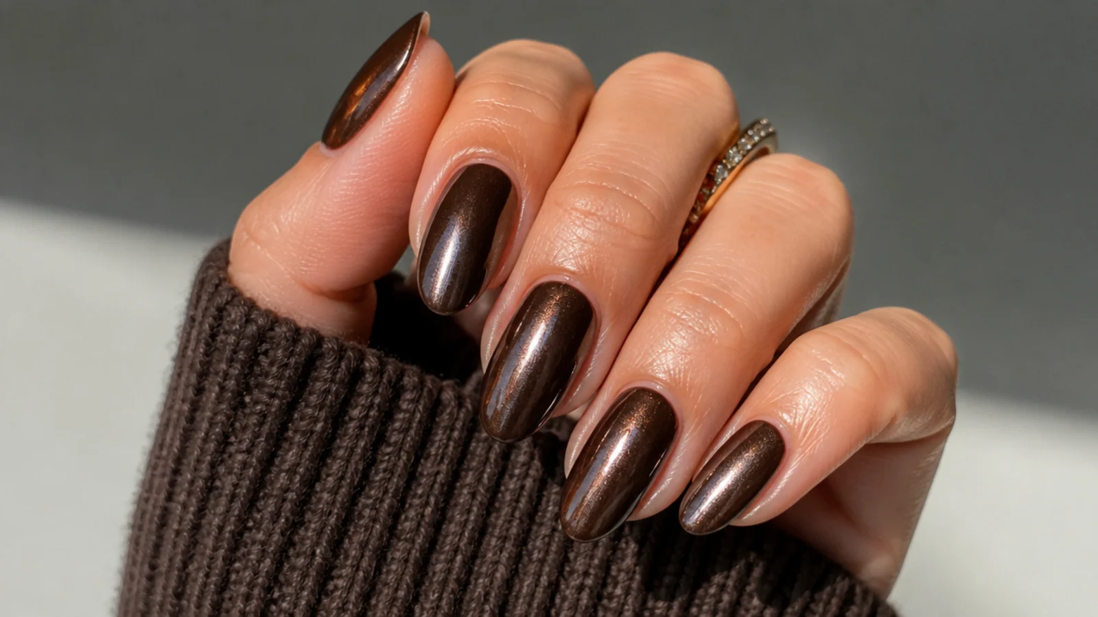 Glazed chocolate brown December nails with a pearly sheen