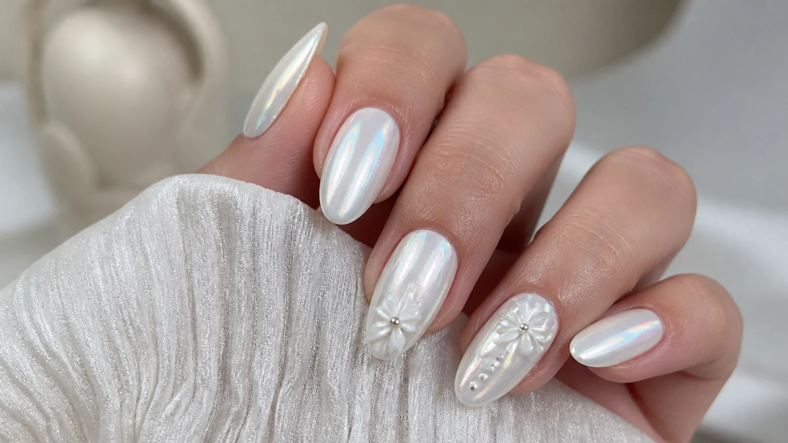 Pearly white chrome December nails with an iridescent sheen