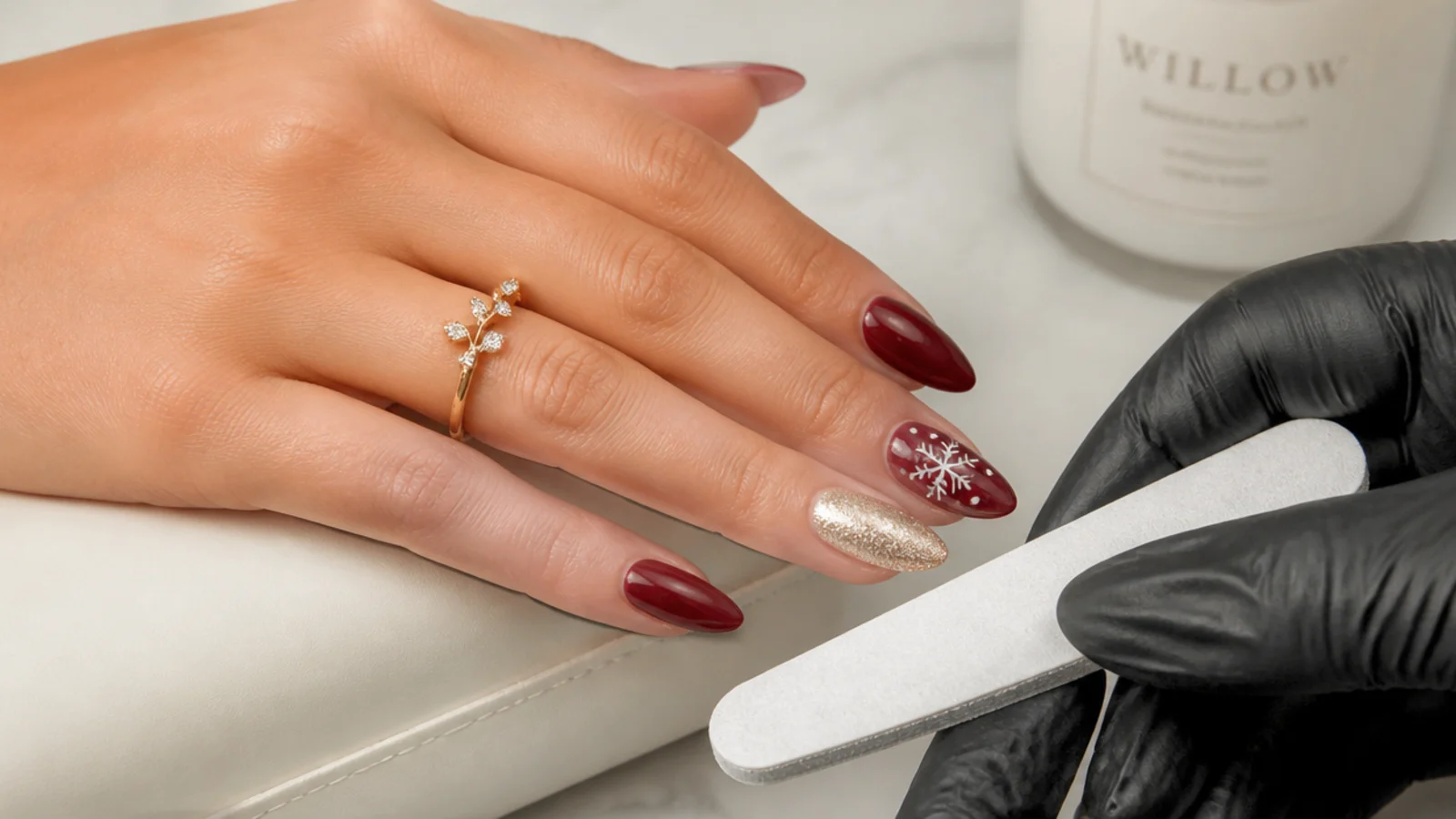 Nails being shaped and buffed in preparation for a gel December set