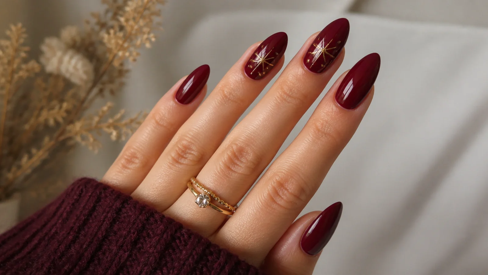 Deep vampy oxblood red December nails on long almond shape