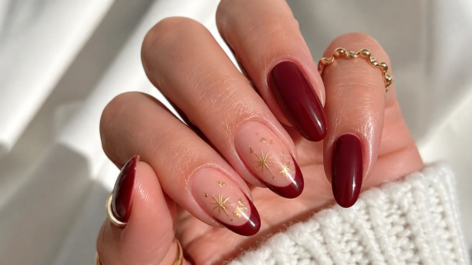 Well-sealed glossy red gel December nails with cuticle oil for longevity