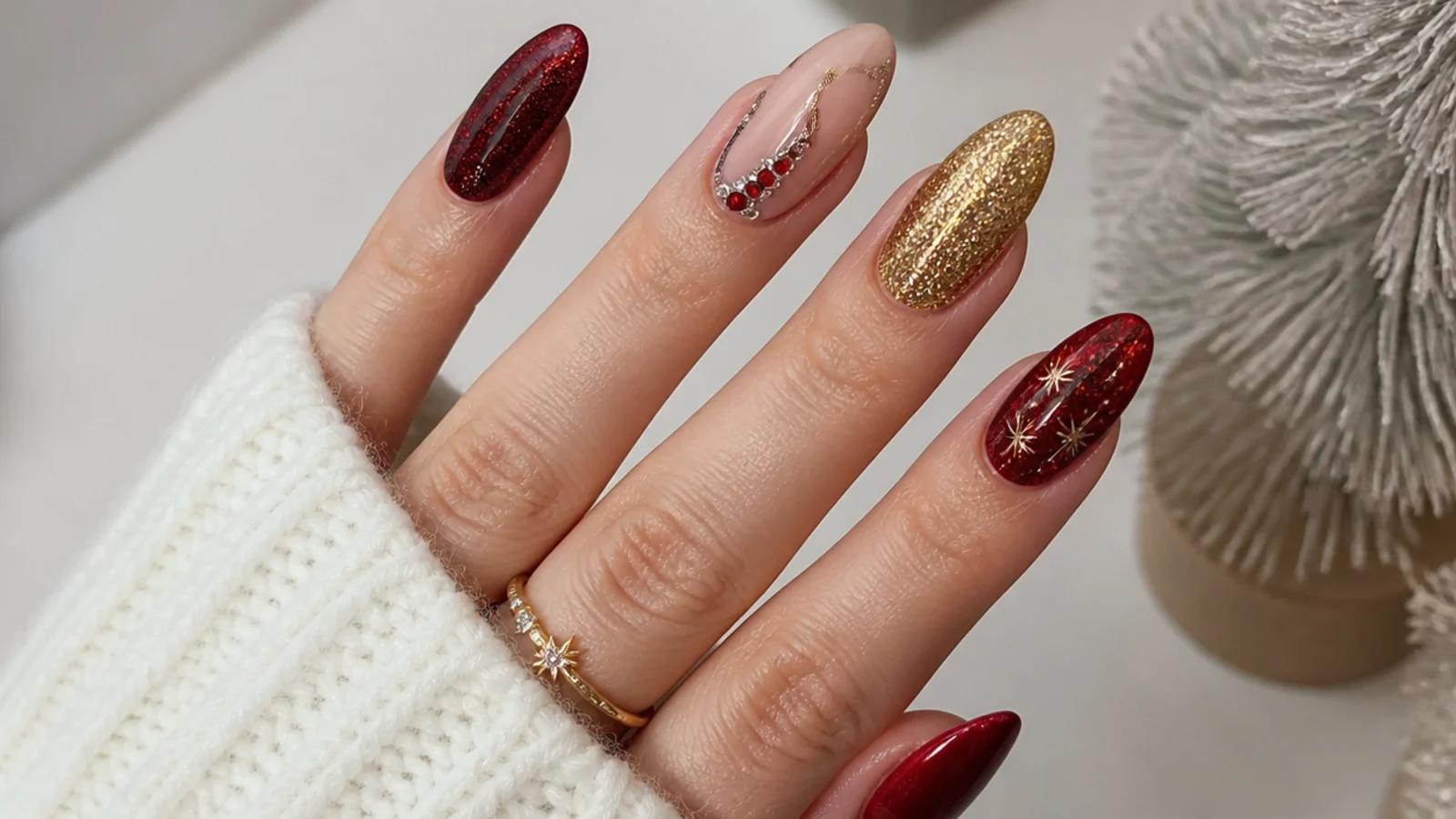 Red and gold glitter New Year's Eve December nails with rhinestones