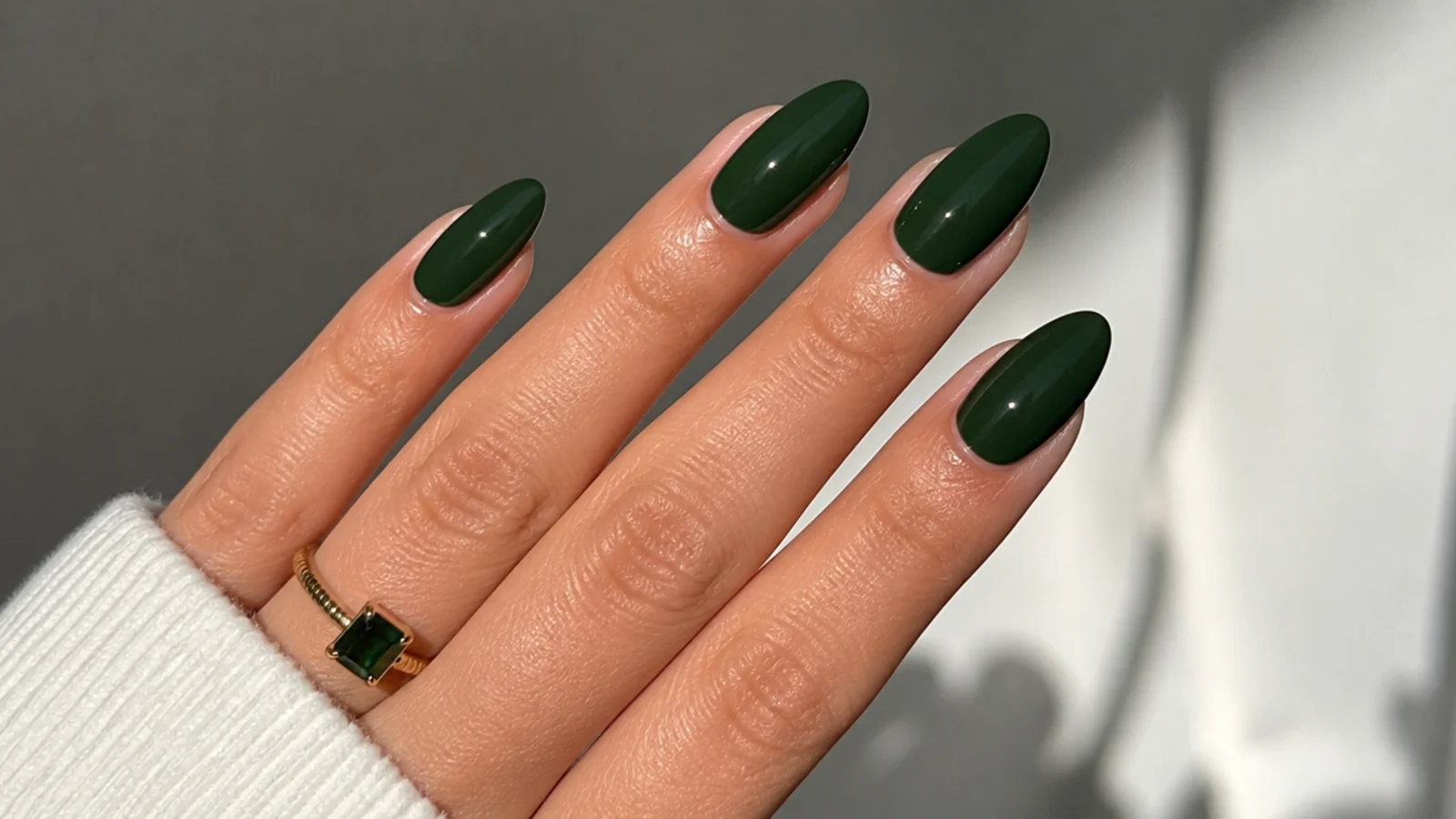 Deep forest green creme gel nails on almond shape