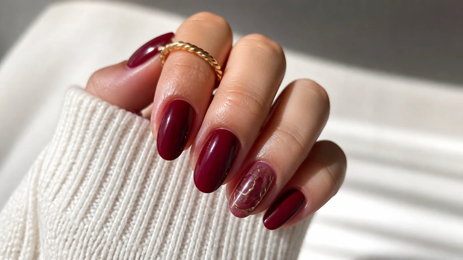 Deep burgundy wine gel nails on short almond nails