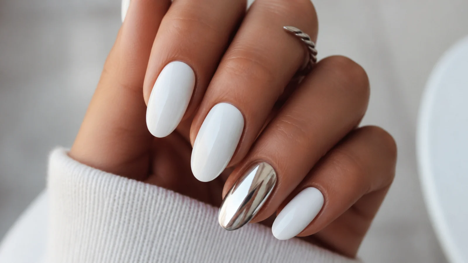 White December nails with a mirror silver chrome accent nail