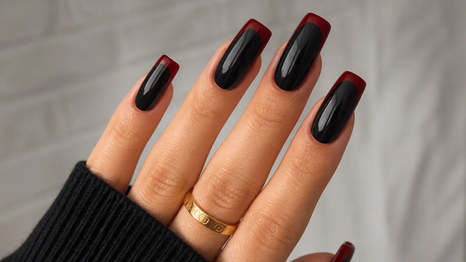 Blood-red French tips over black acrylic nails