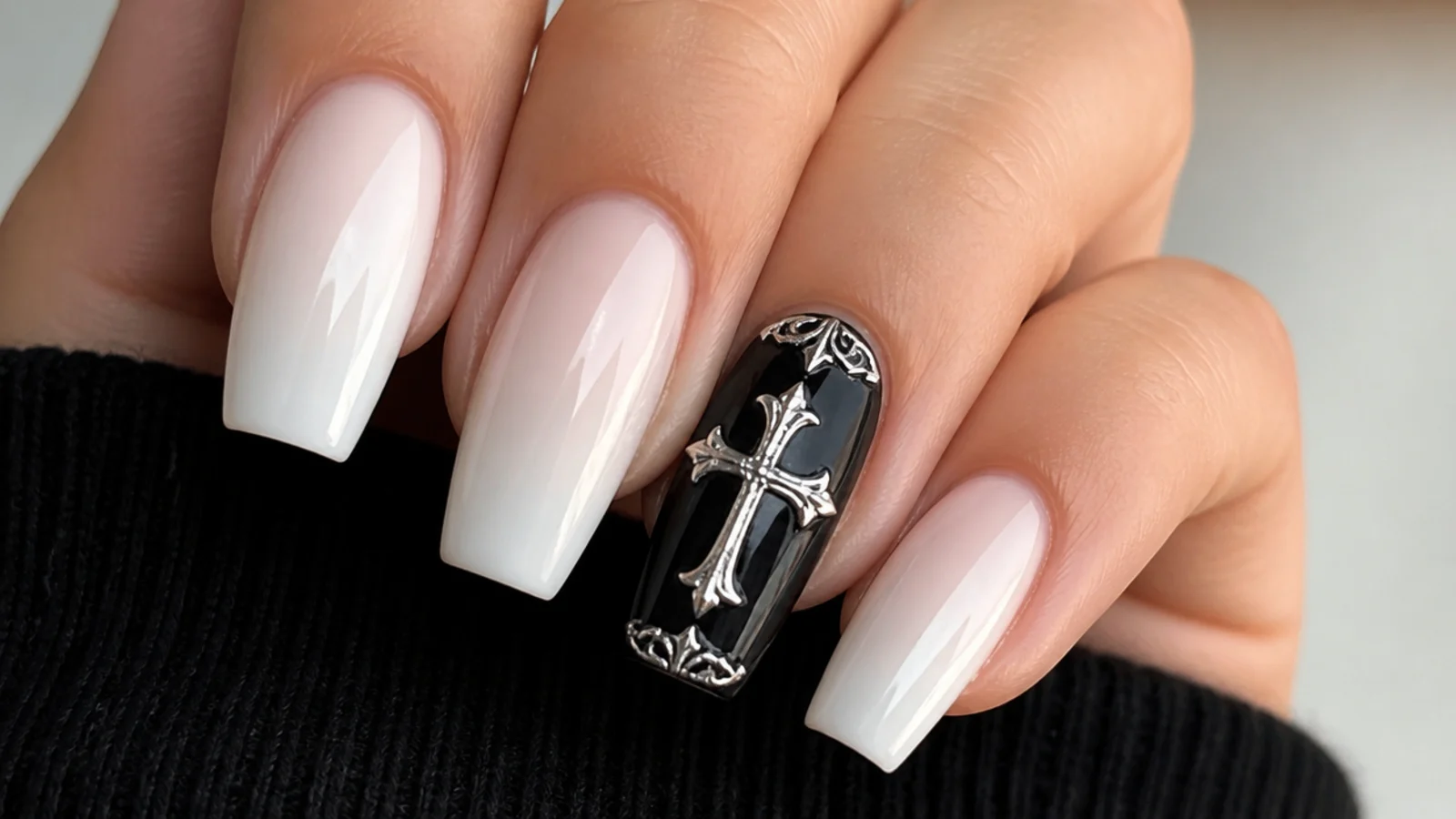Silver and white gothic cross on a black acrylic accent nail