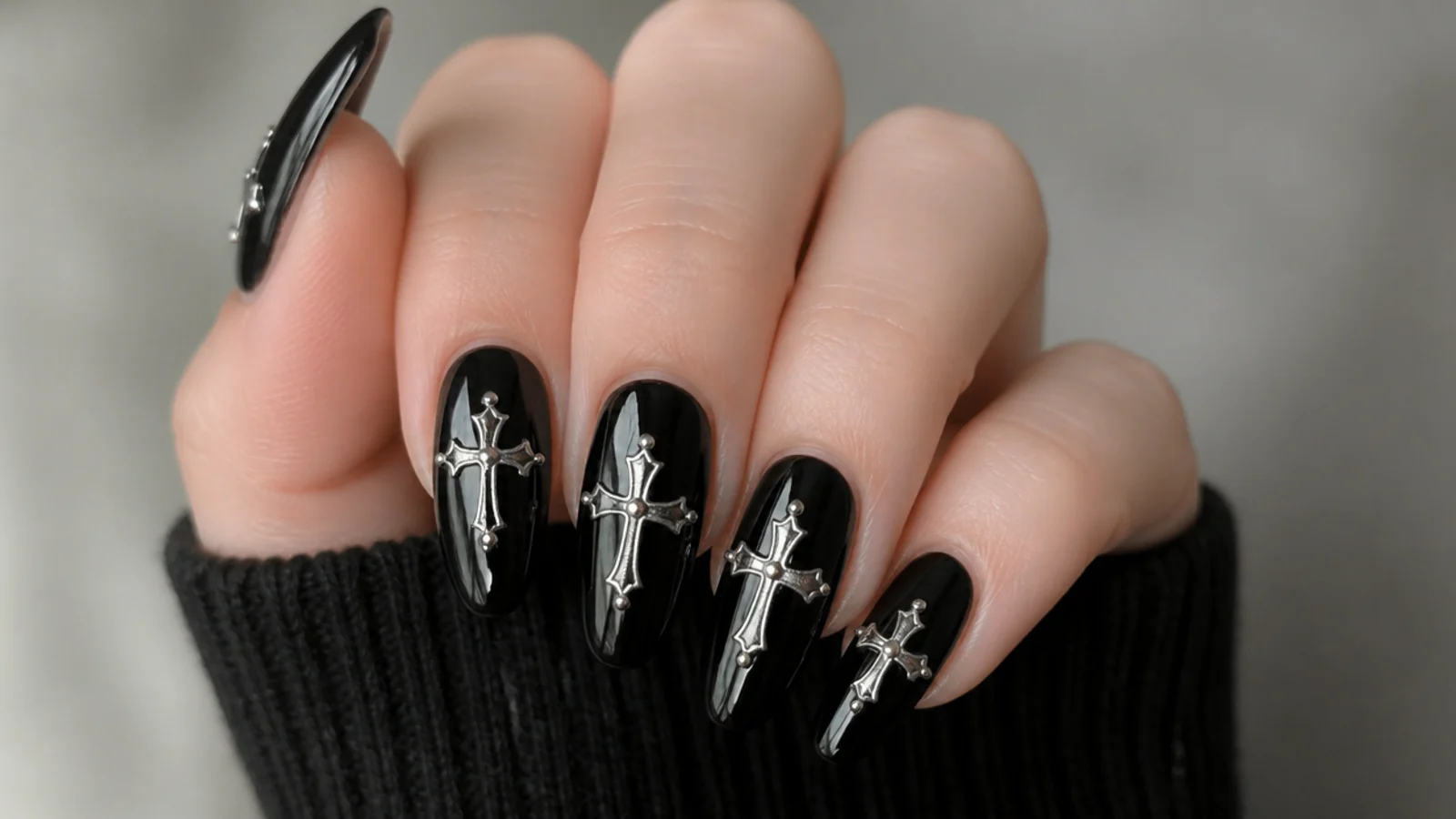 Black nails with silver chrome cross accents, gothic emo baddie style