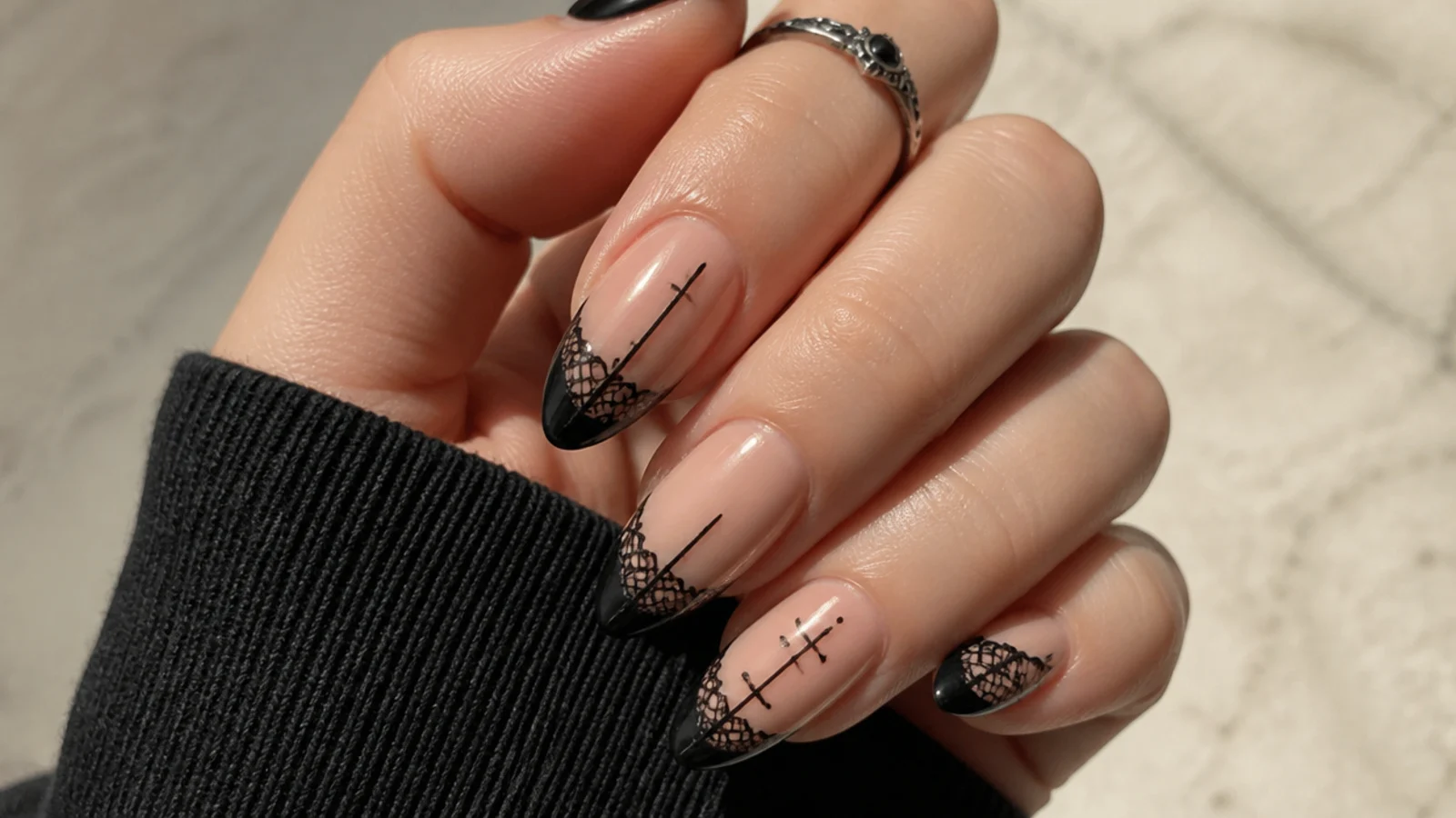 Black nails with fine lace and cross line detail, gothic emo baddie style