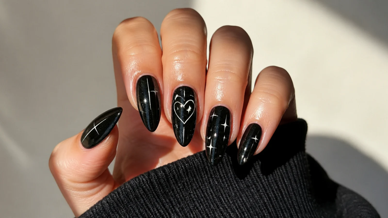 A well-sealed black emo manicure with cuticle oil for longevity