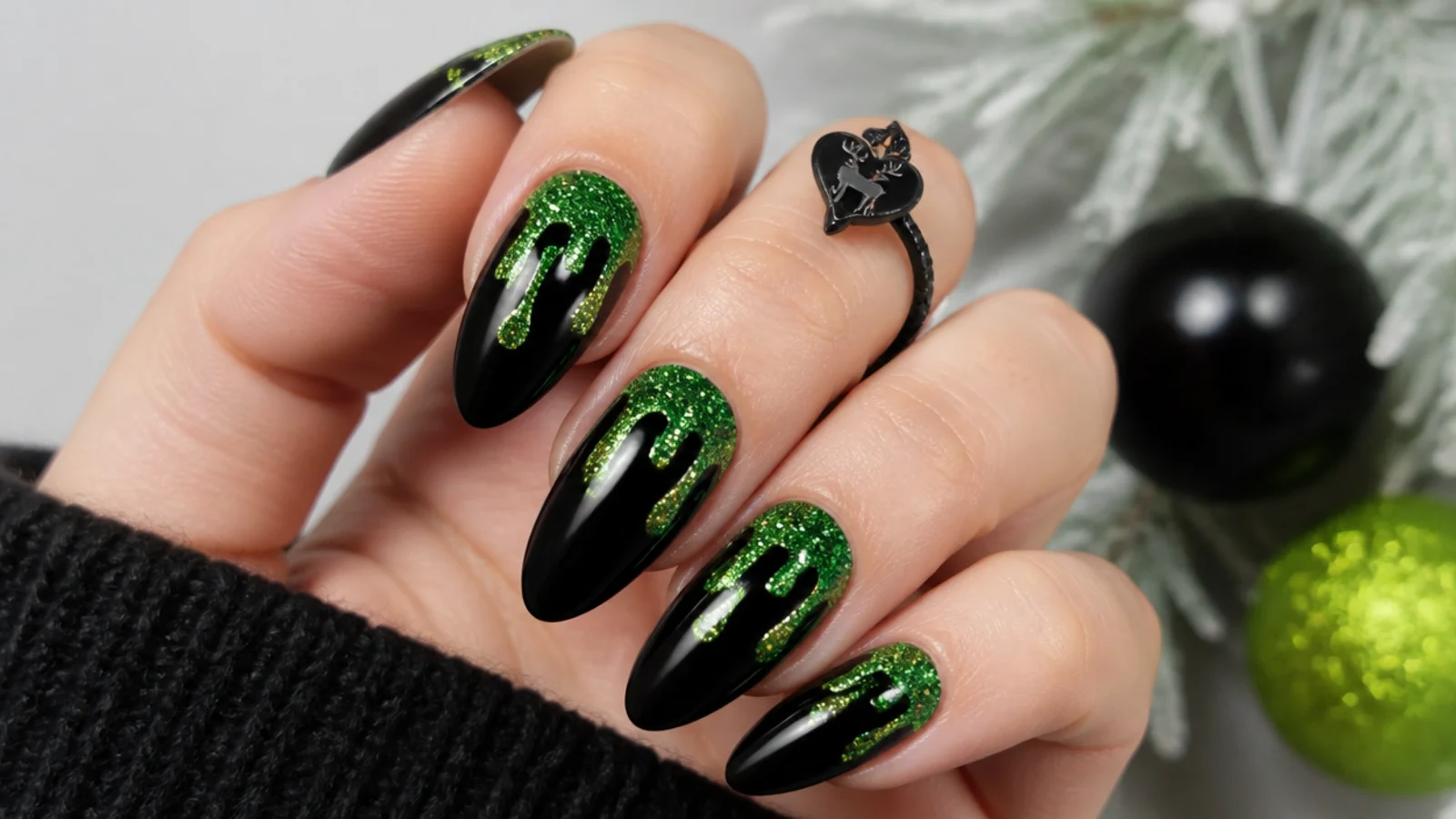Black emo Christmas nails with bright green glitter drips running down glossy tips