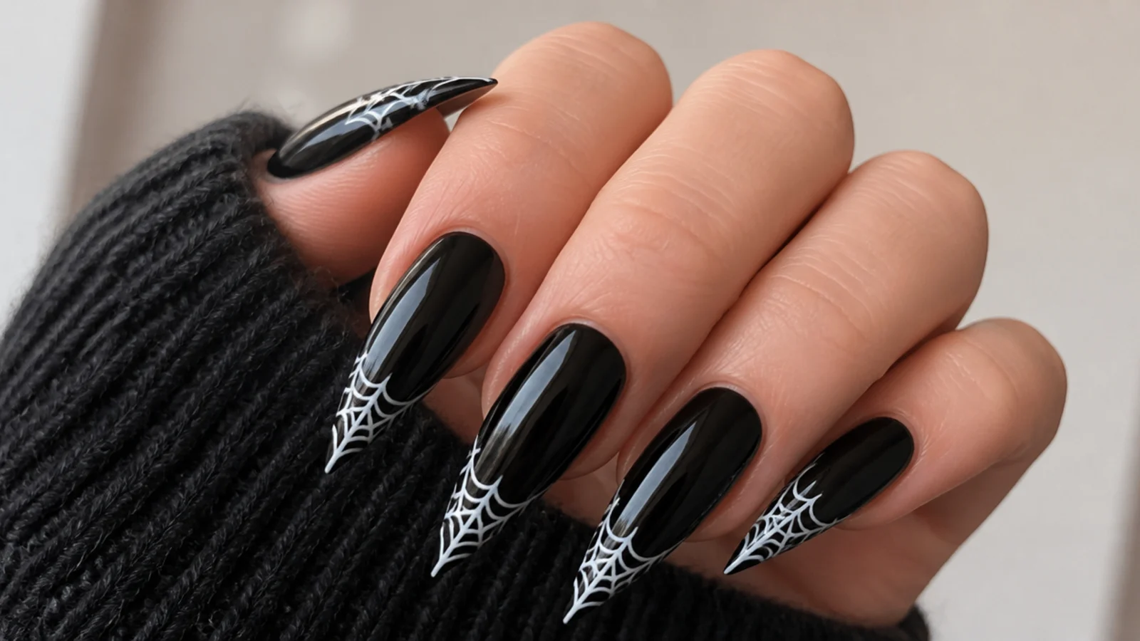 Black stiletto emo nails with fine white spiderweb tips