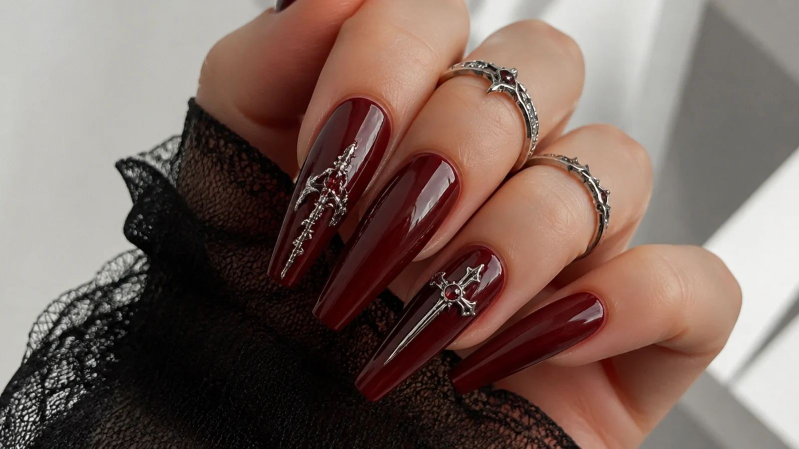 Deep oxblood red coffin emo nails with a glossy finish