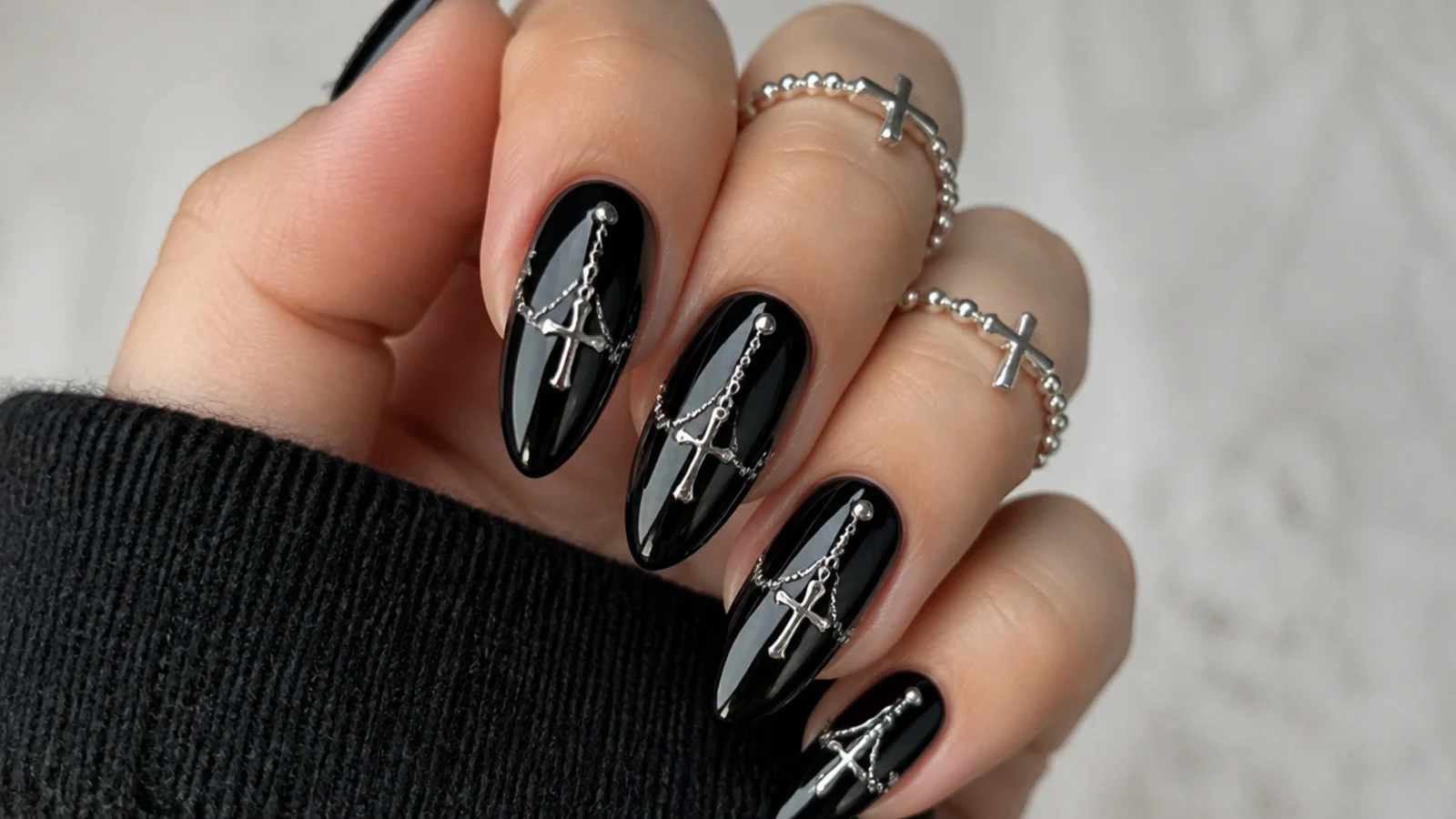 Black emo nails with fine silver crosses and rosary bead chains