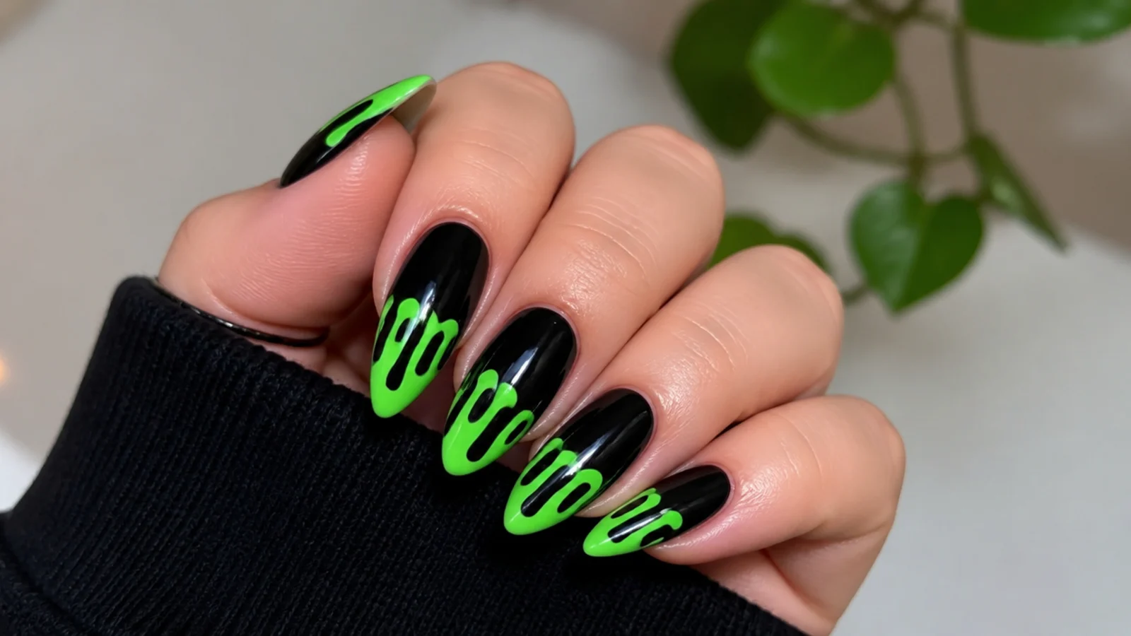 Black emo nails with dripping neon green slime from the tips