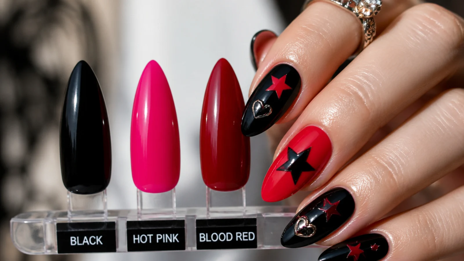 Swatches of black, hot pink and blood red emo nail colors with motif art