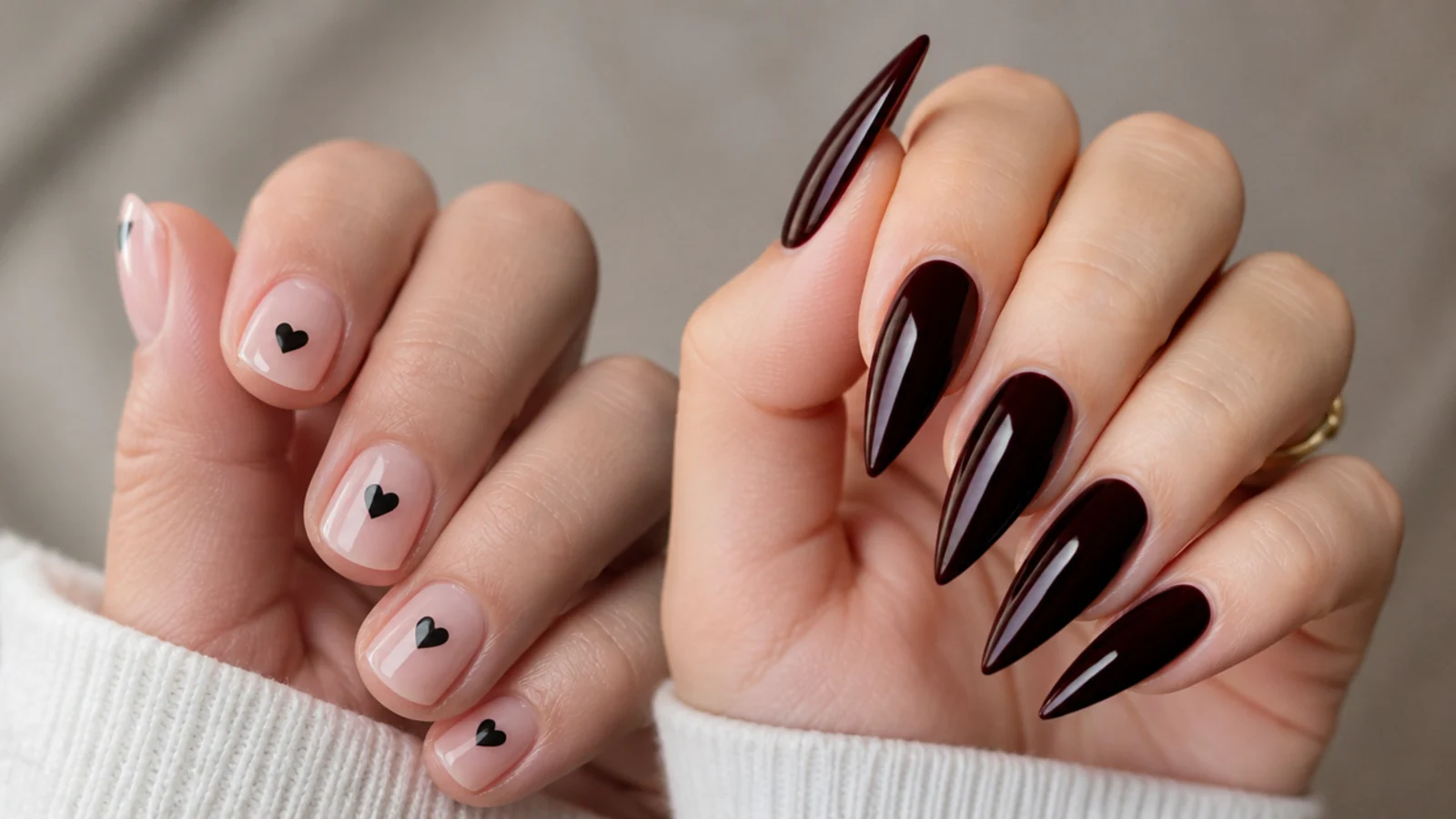 Short round nails with small black heart motifs beside a bold stiletto set