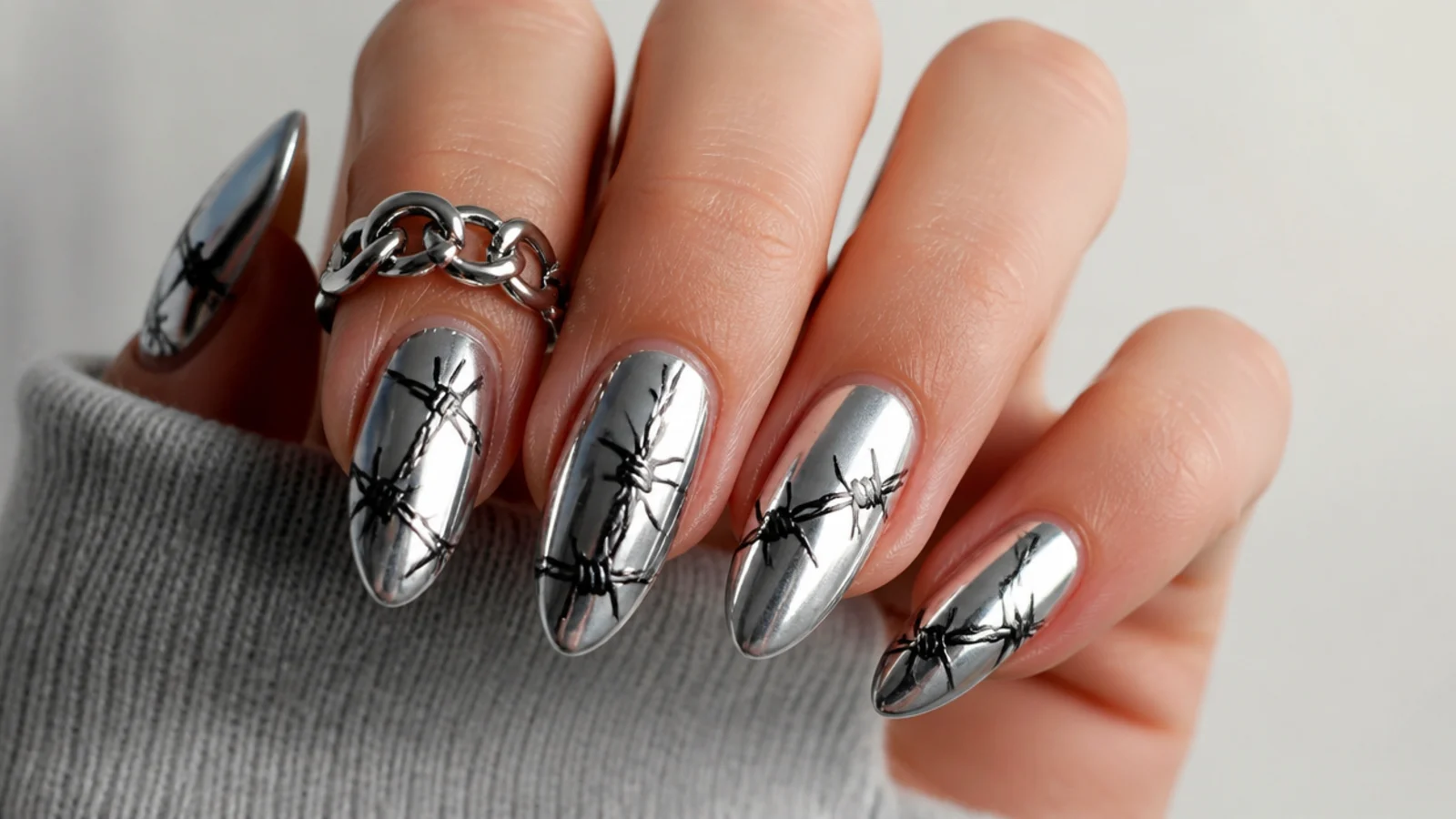 Silver chrome emo nails with black barbed wire line art