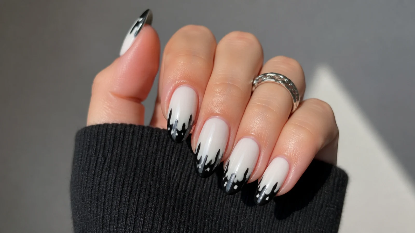 White emo nails with black paint drip french tips