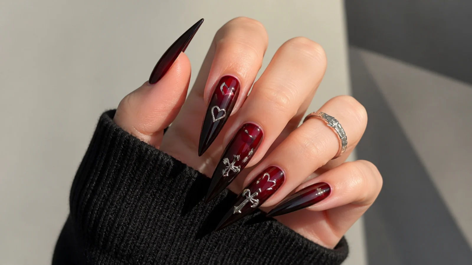 Deep cherry red emo nails on stiletto shape