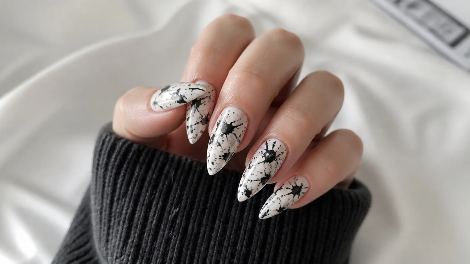 White emo nails with black paint splatter grunge effect
