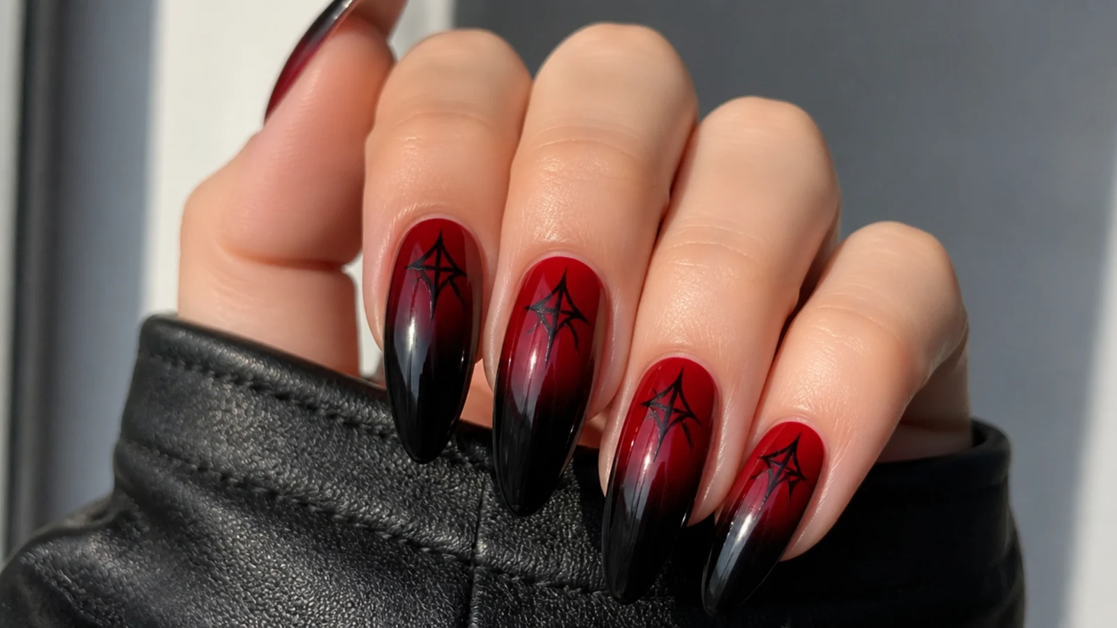 Emo nails fading from deep red at the cuticle to black at the tips